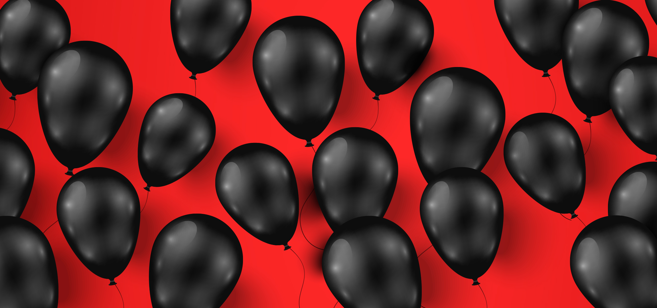 Fekete léggömbök piros háttérrel, ünnepi hangulatot teremtve.